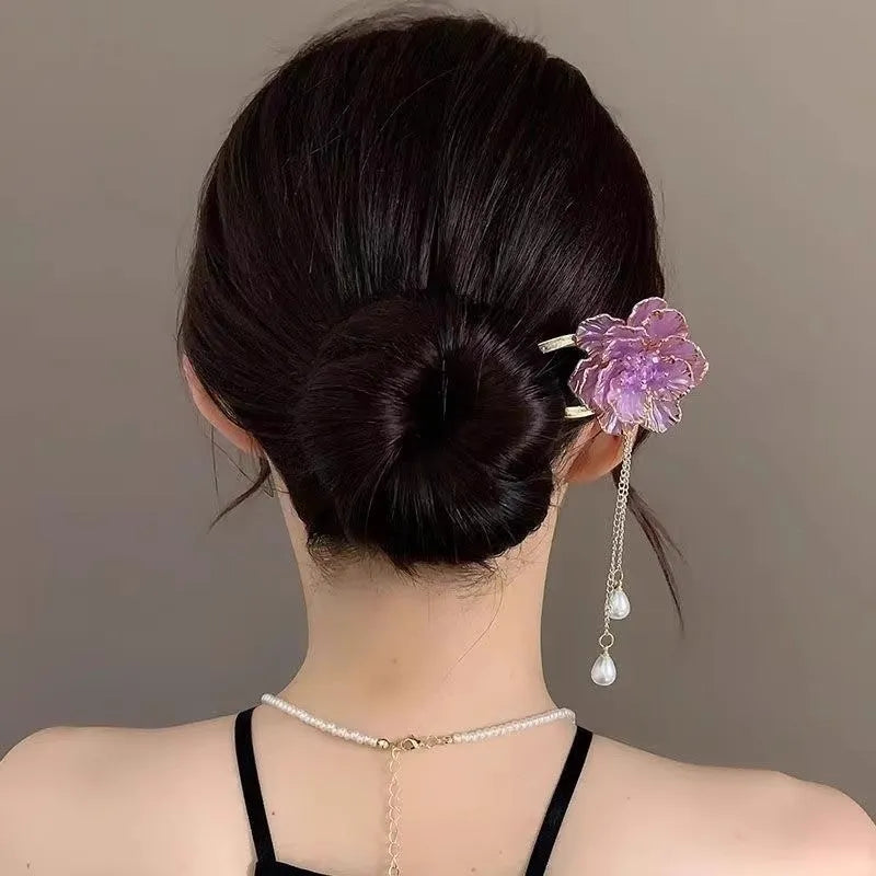 Close-up of a retro-style alloy U-shaped hairpin with a detailed purple peony flower and tassel design.