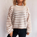 Woman wearing a vintage striped loose-fit pullover sweater in a khaki colour.