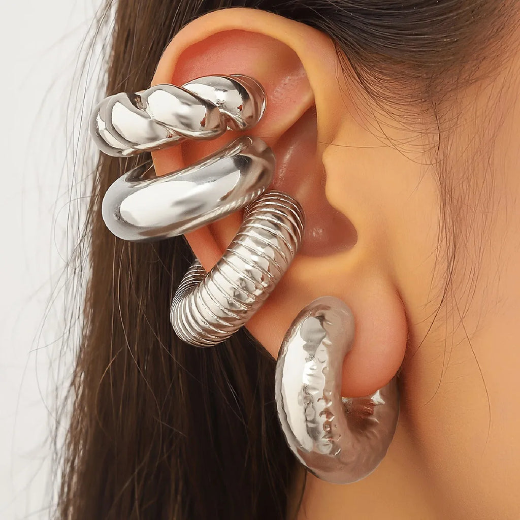 Set of four geometric clip-on earrings for women in gold and silver colours