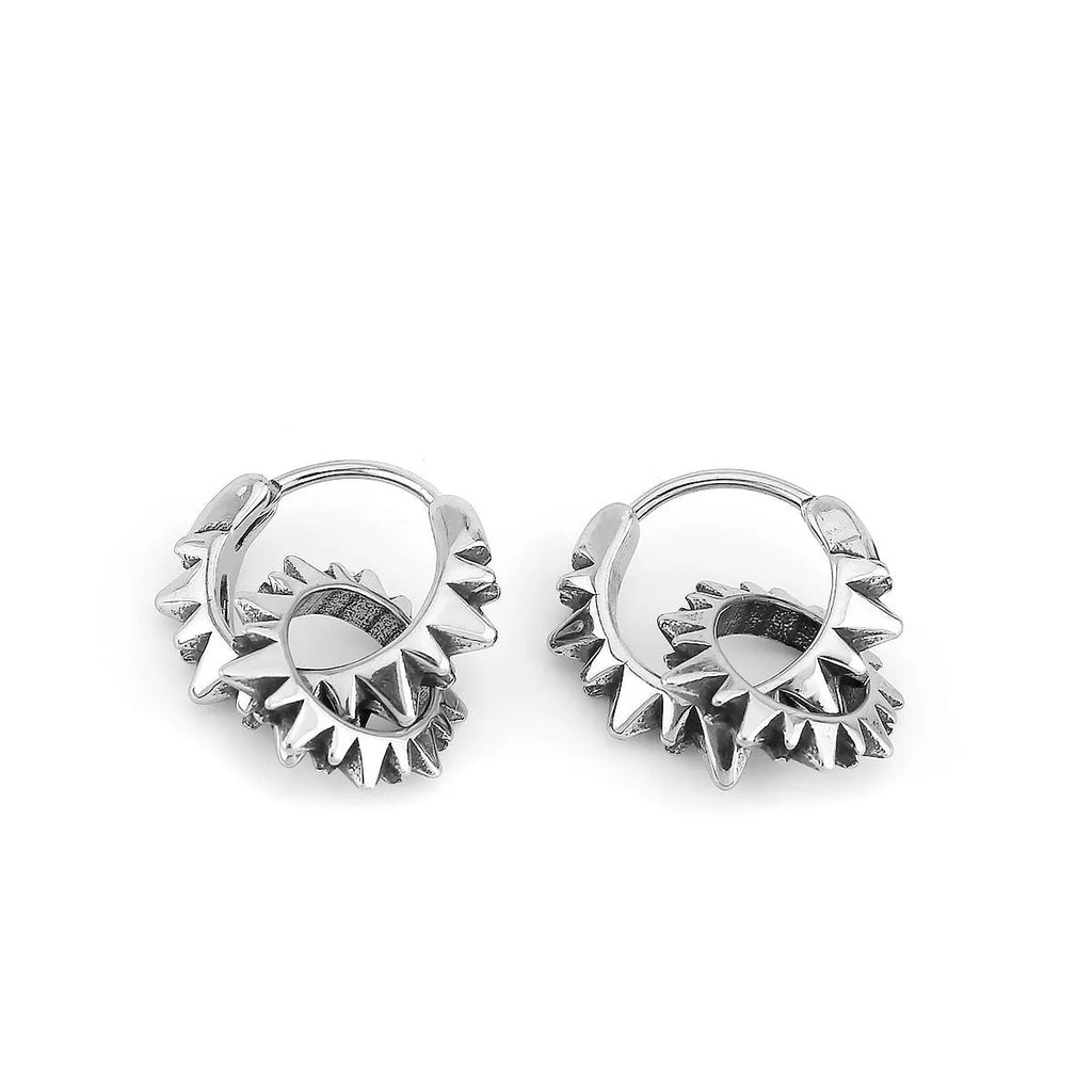 A pair of simple stainless steel round ring earrings with a polished steel colour finish.