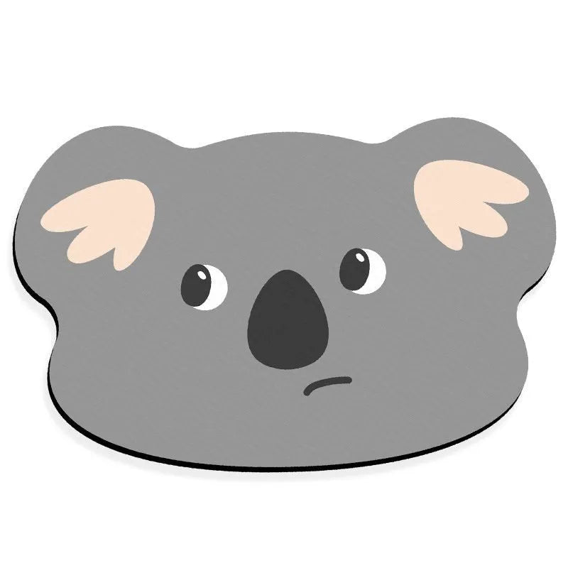Diatomite bathroom absorbent mat in a cartoon animal design on a bathroom floor.