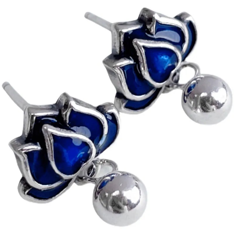 Blue lotus seedpod tassel stud earrings with flower shape, measuring 1.2cm wide.