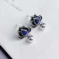 Blue lotus seedpod tassel stud earrings with flower shape, measuring 1.2cm wide.