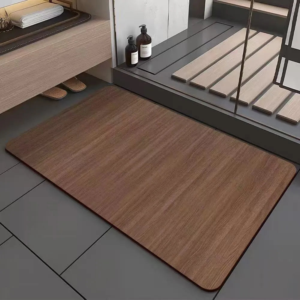 Square diatomite bathroom floor mat with wood grain geometric pattern in a bathroom setting.