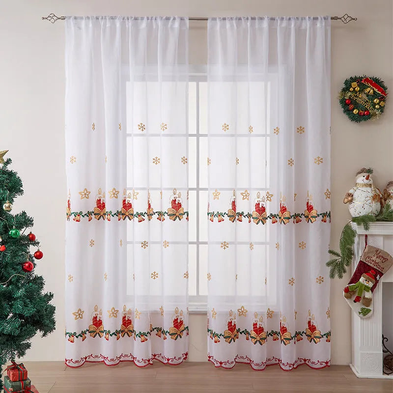 Pair of white Christmas curtains with detailed embroidered red and green snowflake design, showing texture and semi-sunshade fabric.