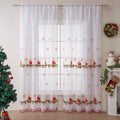 Pair of white Christmas curtains with detailed embroidered red and green snowflake design, showing texture and semi-sunshade fabric.