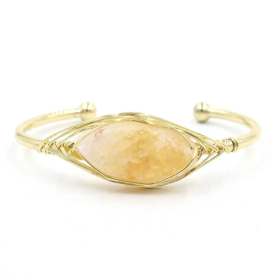 Natural raw gemstone crystal bracelet in ethnic style with simple opening, shown in one of nine colour options.