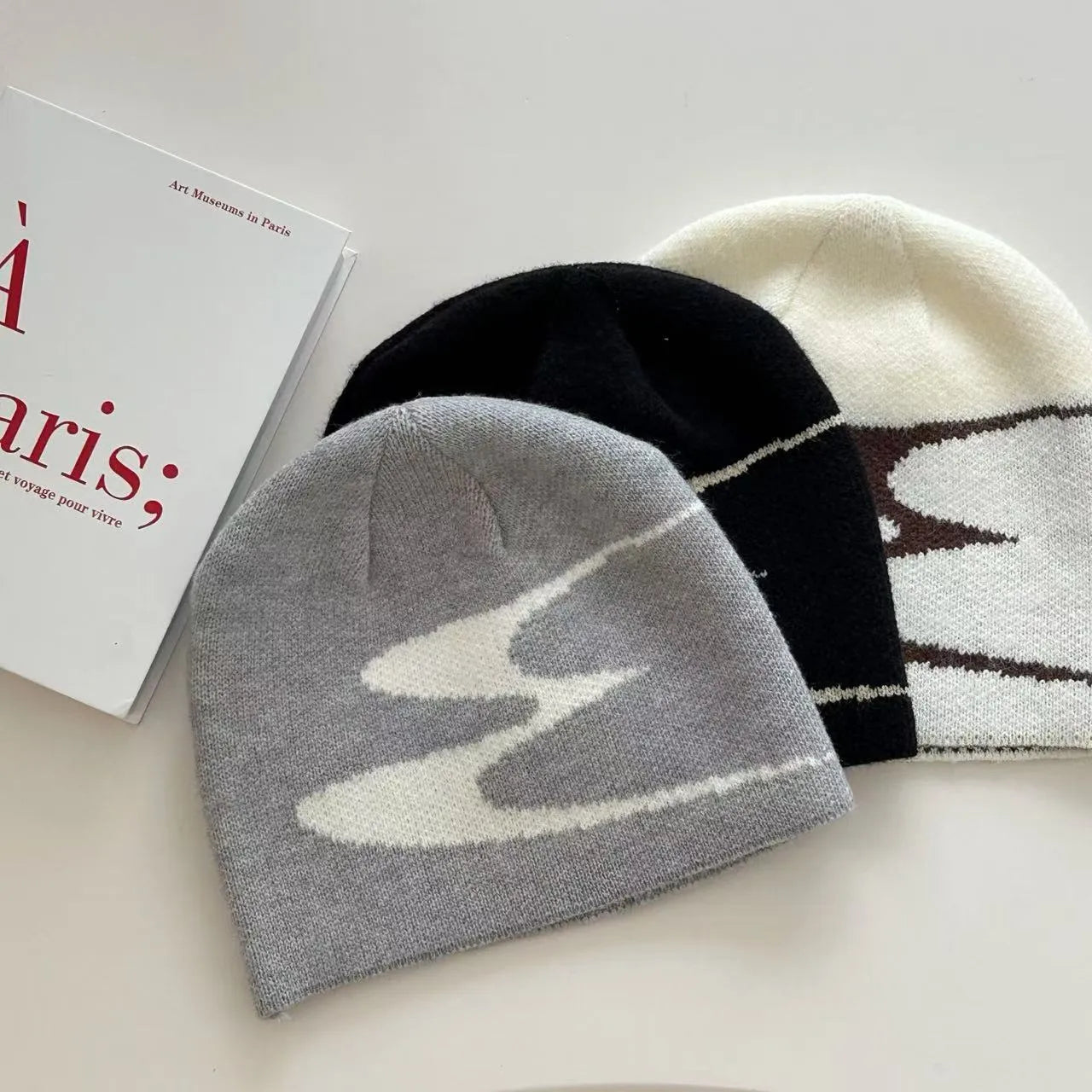 Medium-sized acrylic beanie hat for men and women in black colour showing knit texture