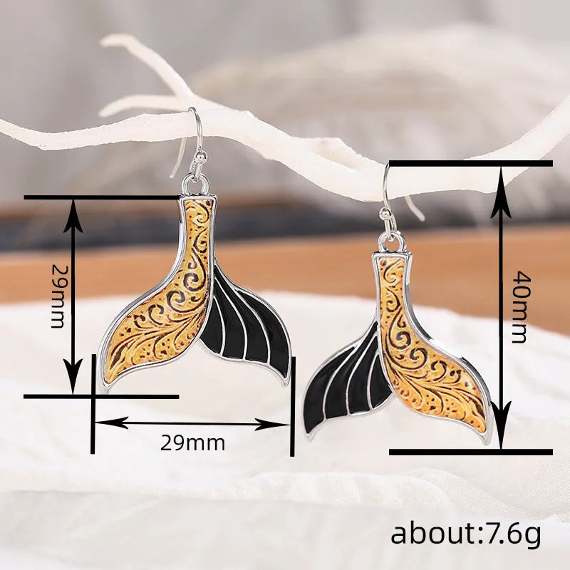 Women's fishtail design earrings with whale motif in white gold colour retro style