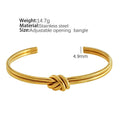 Women's open C-shape knotted double-layer bracelet in gold or silver plating on a wrist.