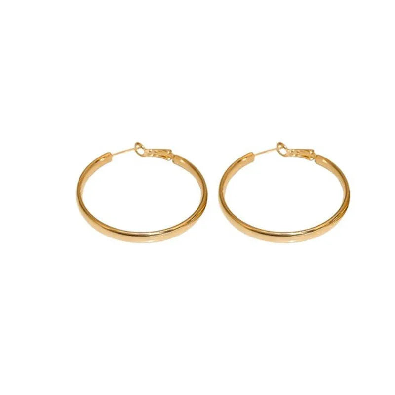 A pair of circular open-ring metal earrings in a gold or silver finish, measuring 40mm.