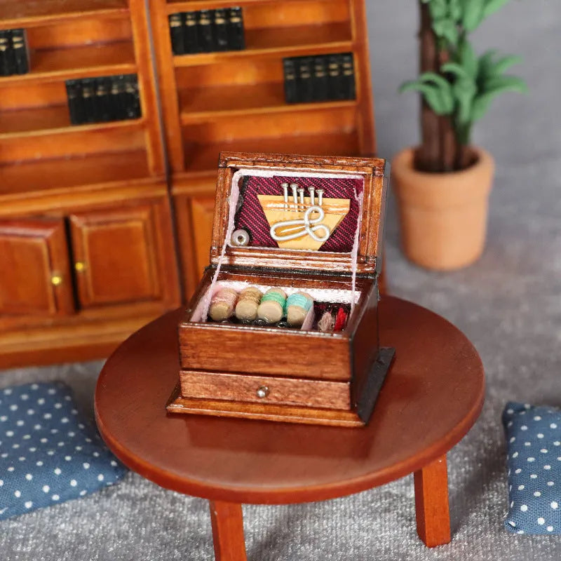 Miniature wooden vintage sewing machine sewing kit with double layer colour design on a white background.