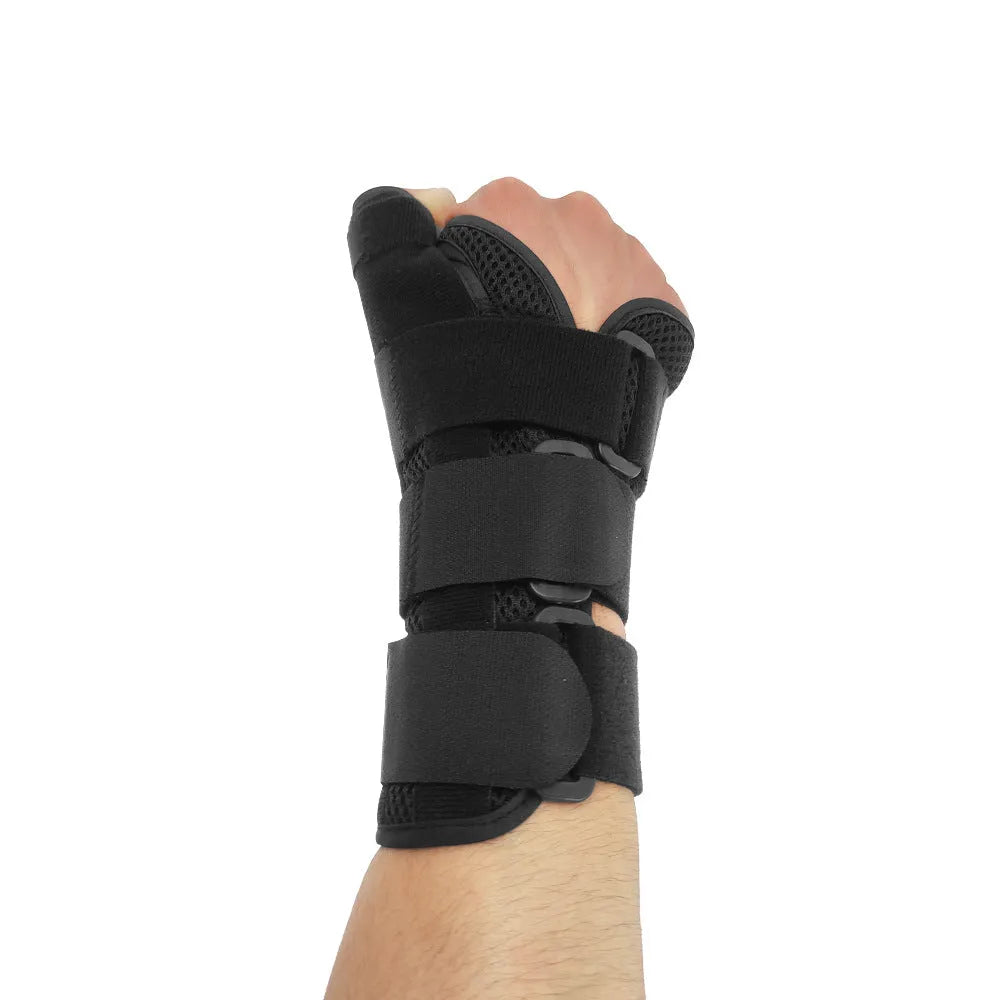 Black carbon fibre sports wrist guard with thumb strap for left or right hand support