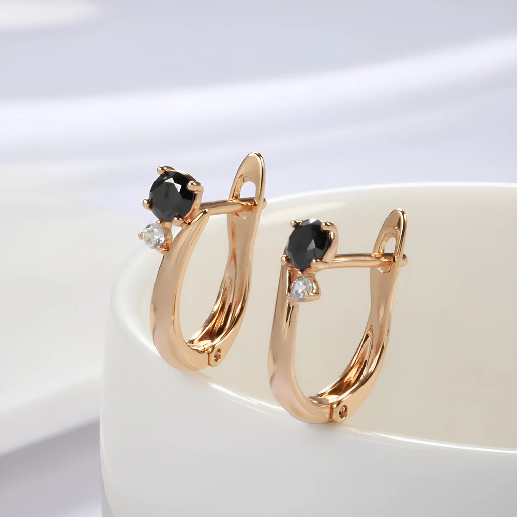Gold drop earrings with black geometric stones in retro style design