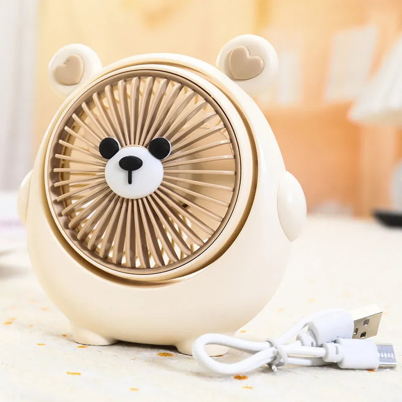 Desktop USB electric fan with cute dog design showing six colour options including bear brown and pink puppy variations