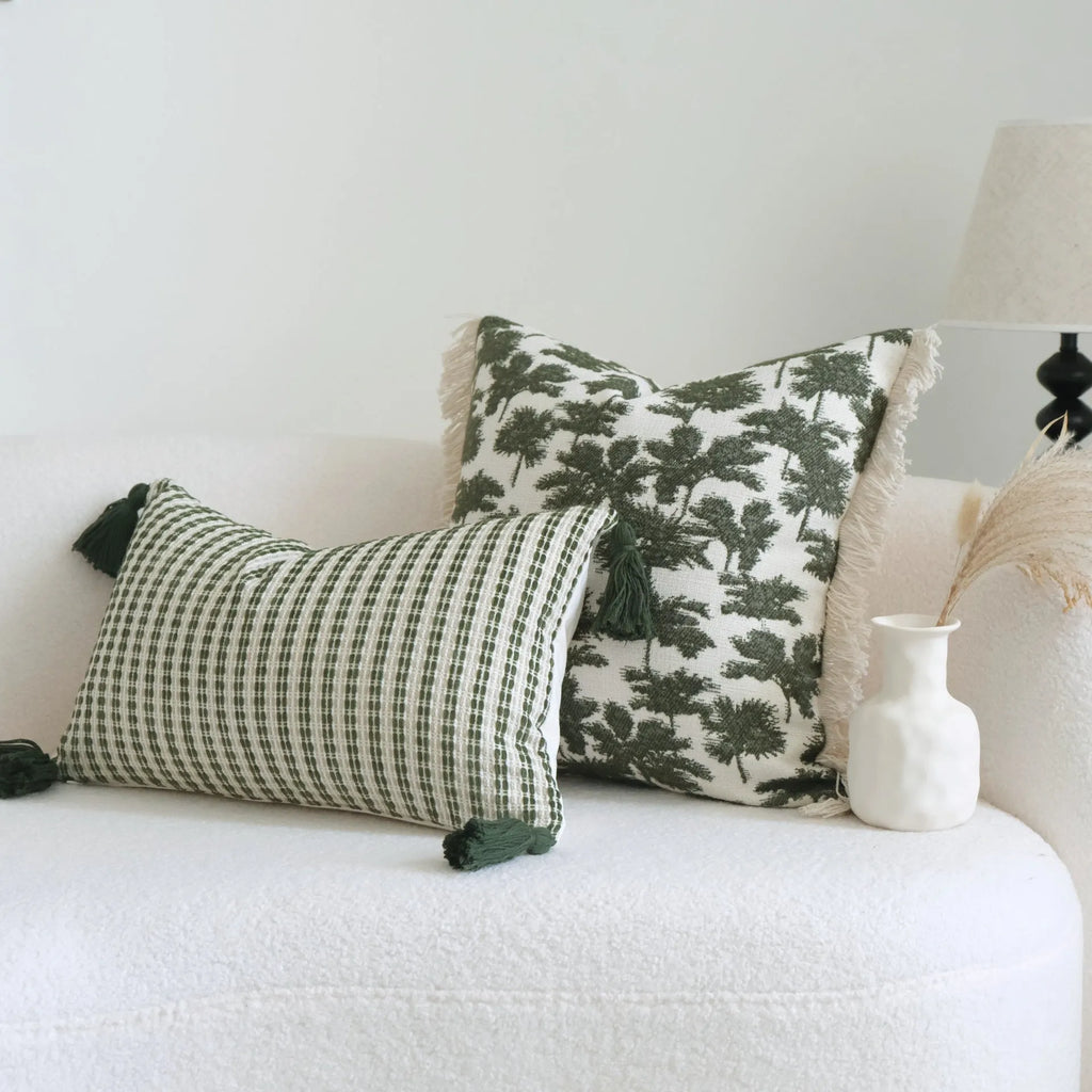 Green botanical pattern hotel sample pillow with tassel detail on linen cotton cover