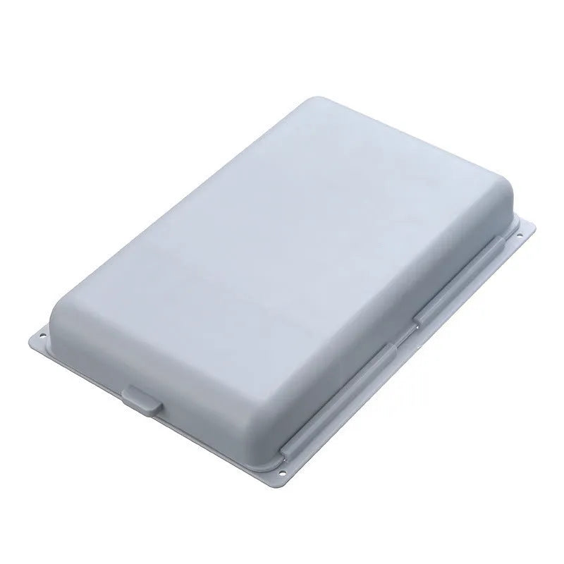 Small white plastic storage box with a grid pattern, shown adhered underneath a wooden table.