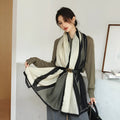 A woman wearing a printed polyester scarf, style 1, measuring 180cm by 90cm.