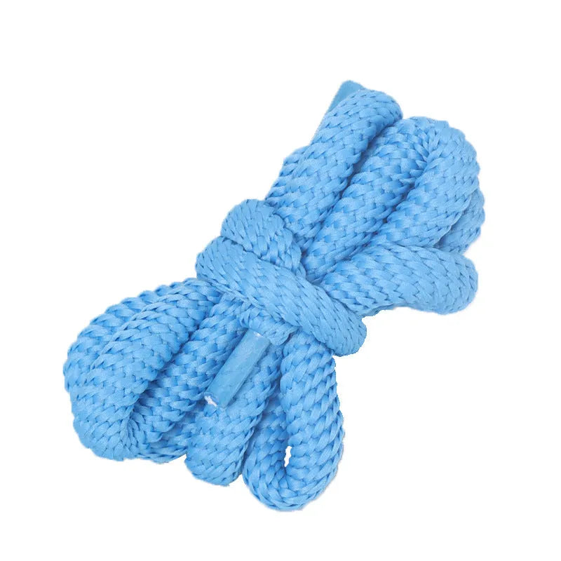 Oval cross-section shoelace adapter rope in various colours, shown next to a trainer and sweatshirt.