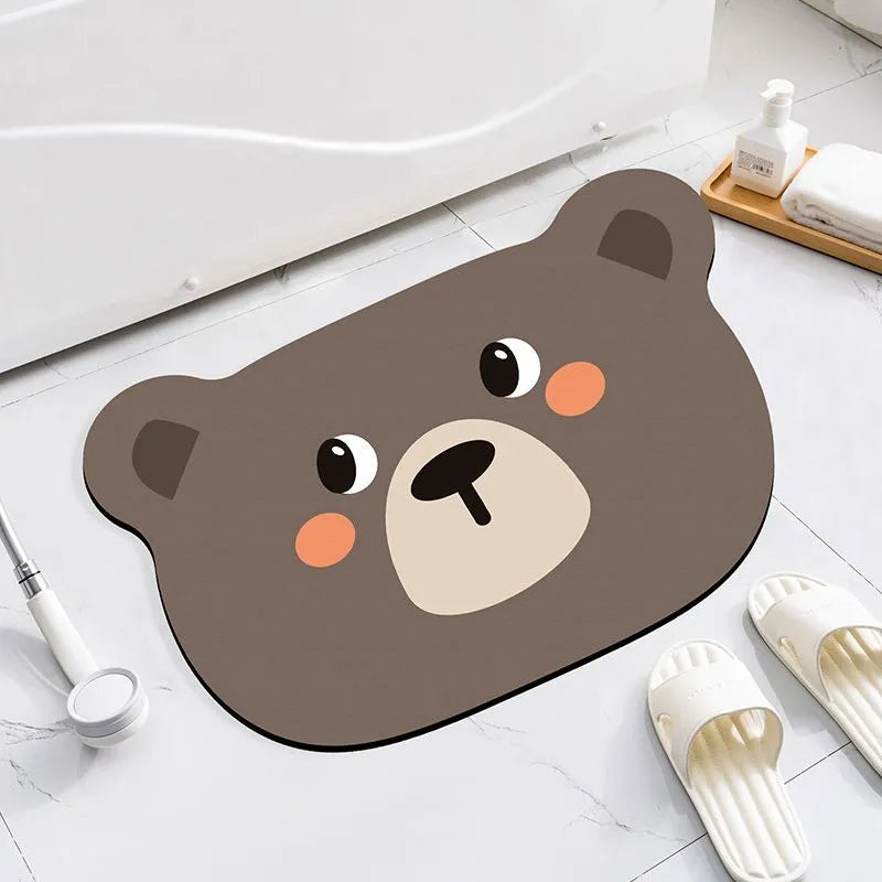 Diatomite bathroom absorbent mat in a cartoon animal design on a bathroom floor.