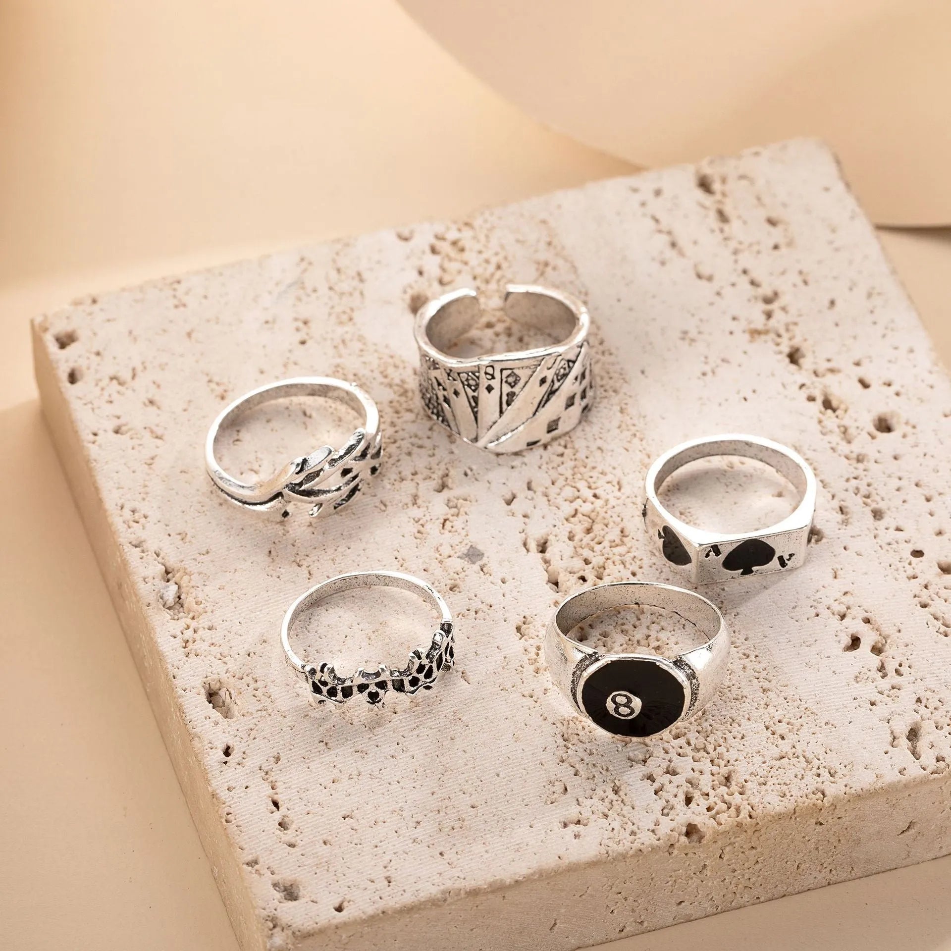 Black alloy poker ring with a large spade design and adjustable band.