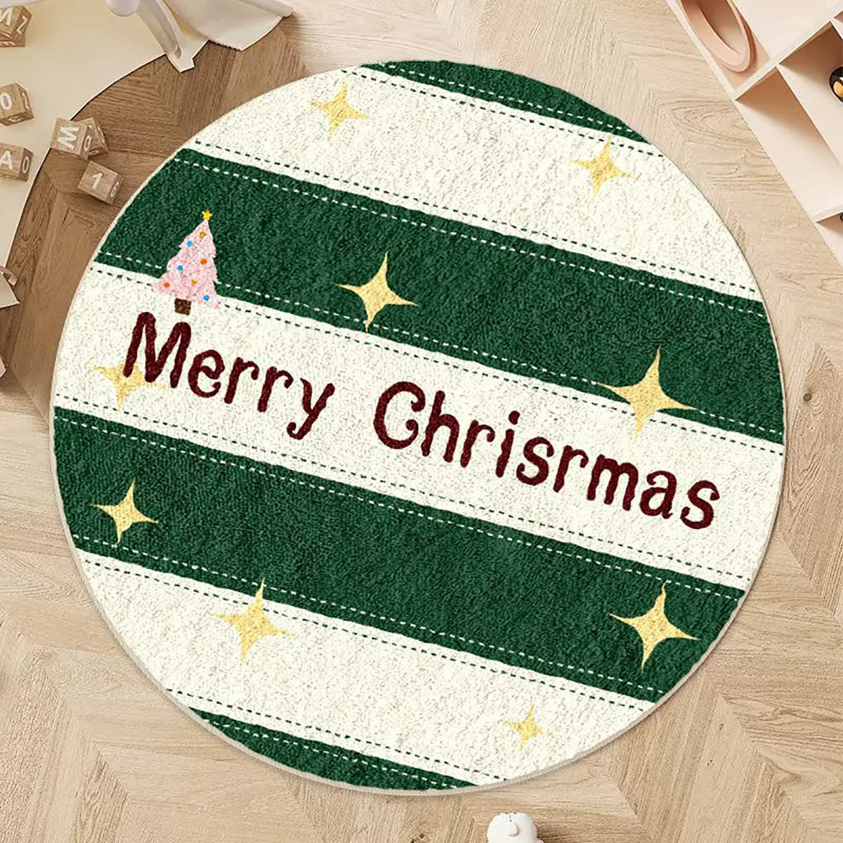 Round Christmas carpet with alien shape design in imitation cashmere material on wooden floor