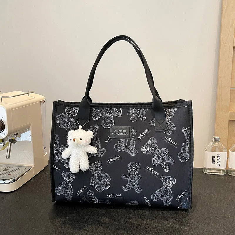 Women's black and white canvas tote bag with rhombus pattern and sandwich pocket design