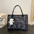 Women's black and white canvas tote bag with rhombus pattern and sandwich pocket design