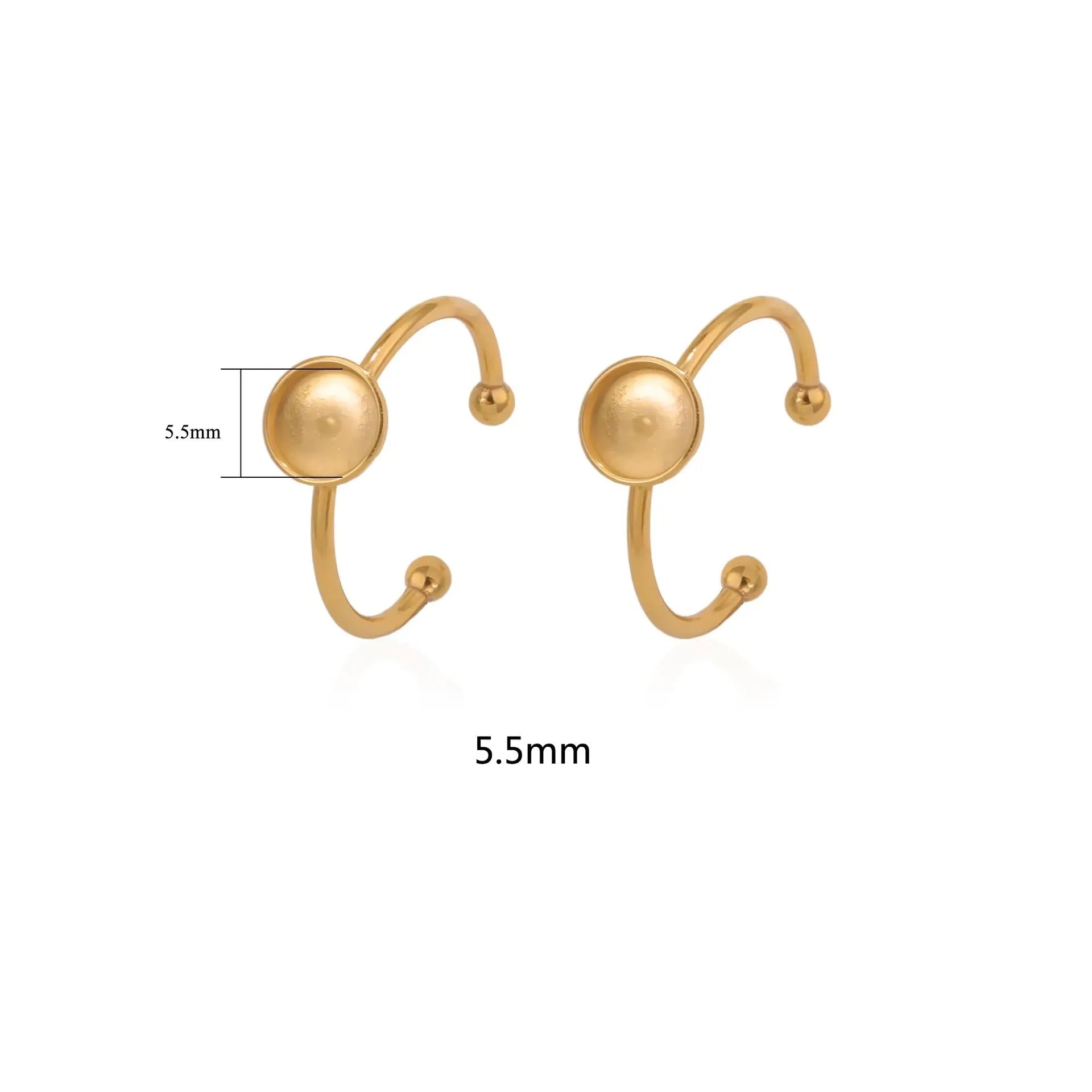 Assortment of golden stainless steel DIY jewellery settings in oval, heart, round, square, and rectangle shapes with totem pattern.