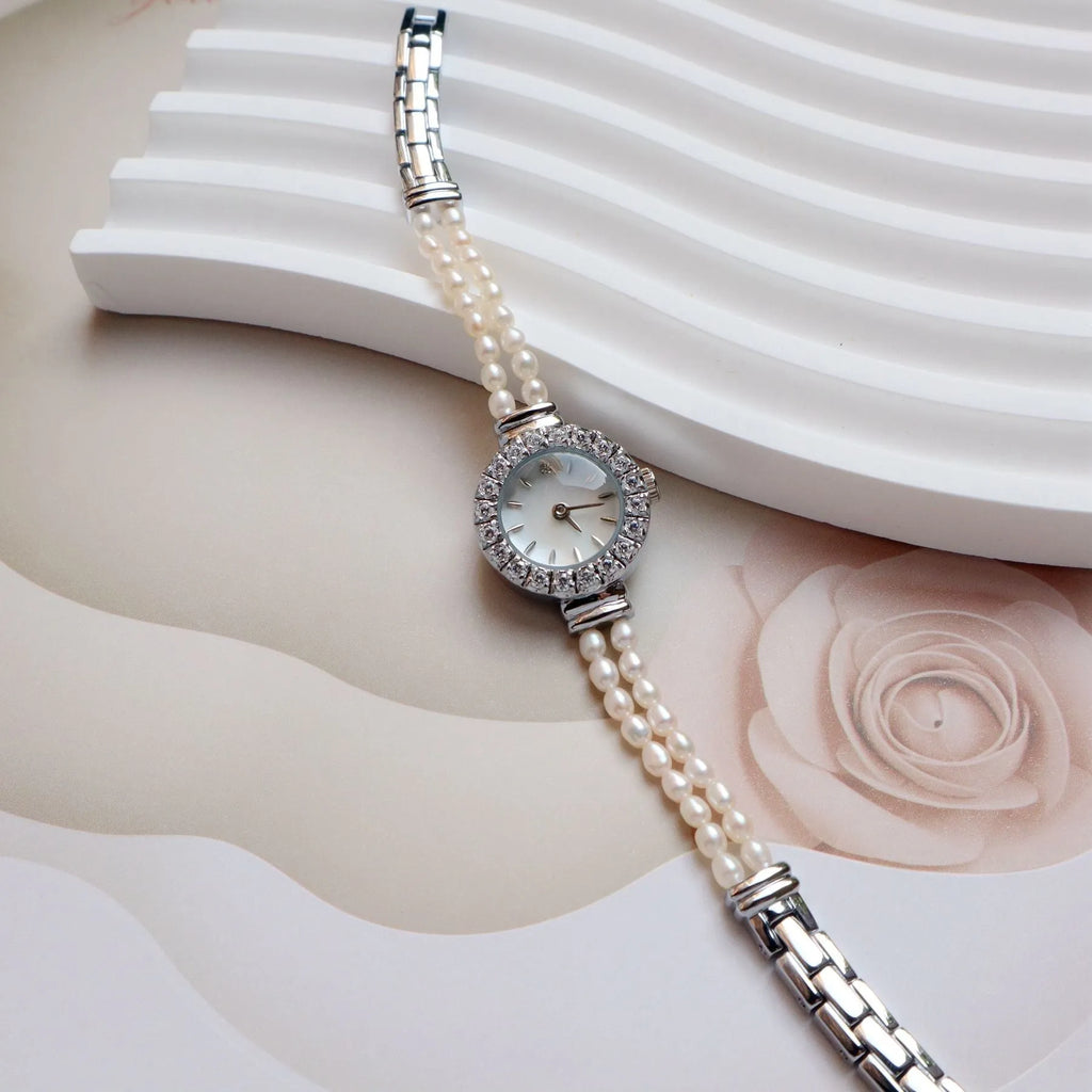 Women's light gold freshwater pearl bracelet watch with round dial and stainless steel strap