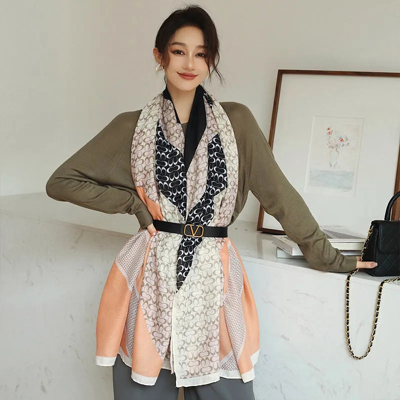 A woman wearing a printed polyester scarf, style 1, measuring 180cm by 90cm.