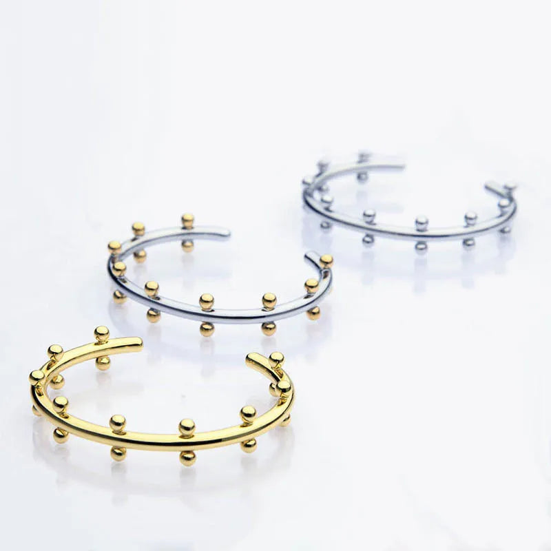 Stainless steel C-shaped bracelet with rivet-shaped bean beads and adjustable alloy chain in steel gold colour