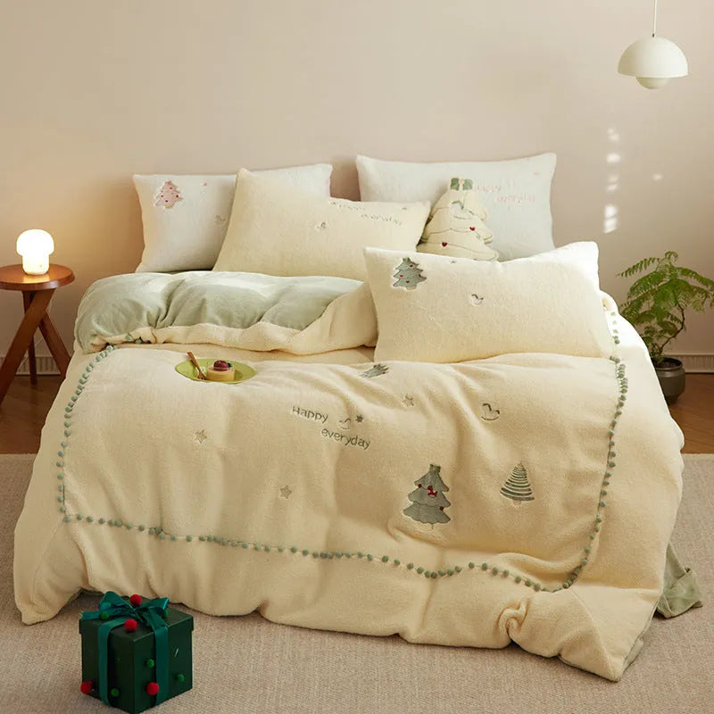 Milk fibre bedding four-piece set with green Christmas tree pattern on duvet cover, sheet, and pillowcases.