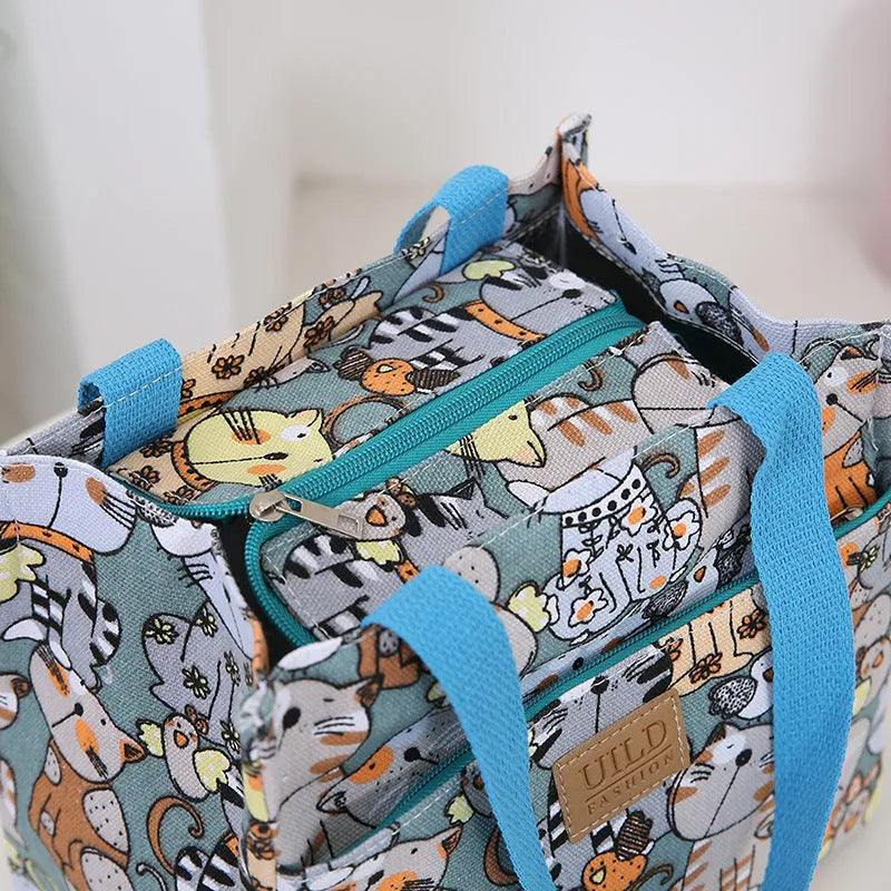 Women's printed canvas handbag with floral design and aluminium hardware in square shape