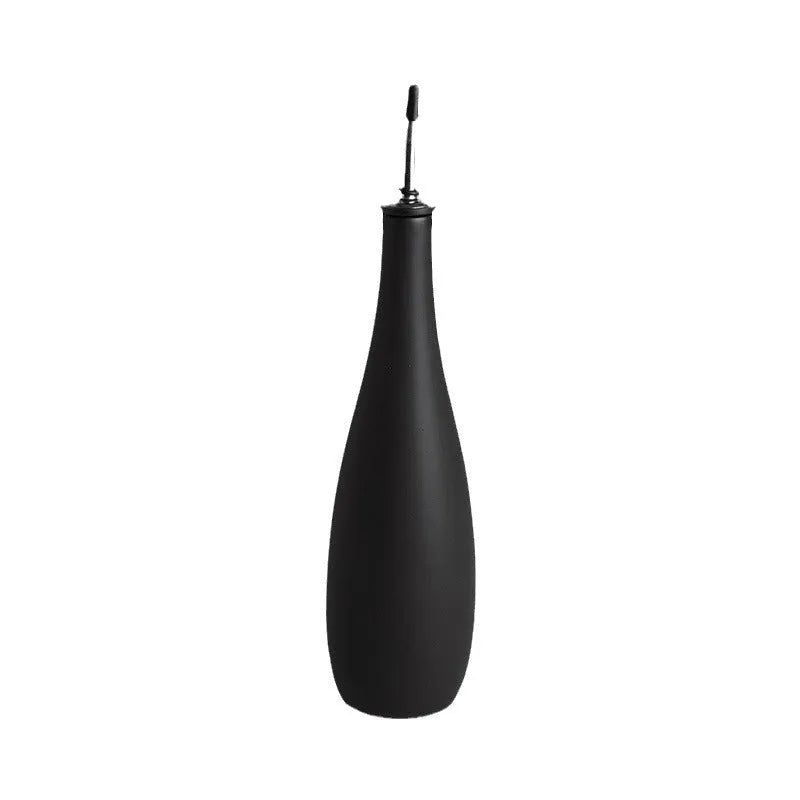 Ceramic oil pot with funnel in black, coffee, and white colour options, 650ml capacity.