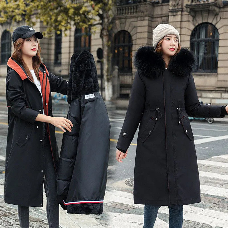 Long beige women's trench coat with cotton-padded fleece construction on a hanger.