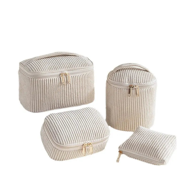 Four cube-style polyester makeup bags in pink, khaki, pink dots, and blue with dots colour options