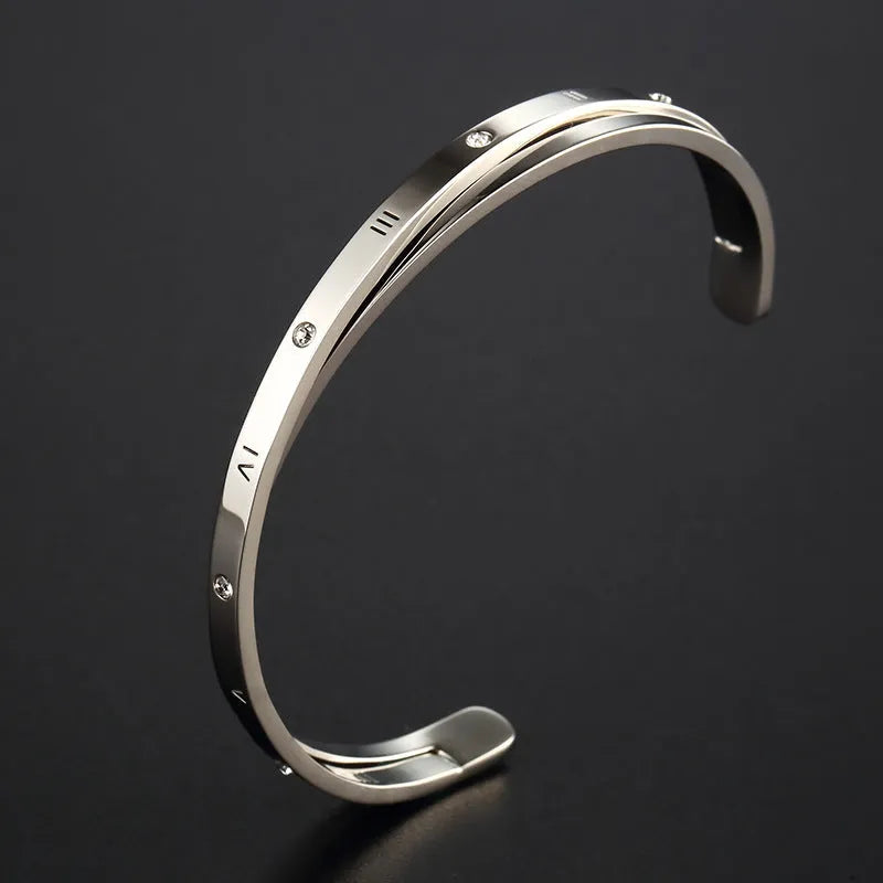 Open-ended adjustable bracelet with inlaid zircon detailing on love theme in rose gold steel colours