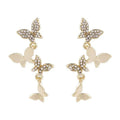 Gold-toned copper butterfly drop earrings with four-butterfly design for women