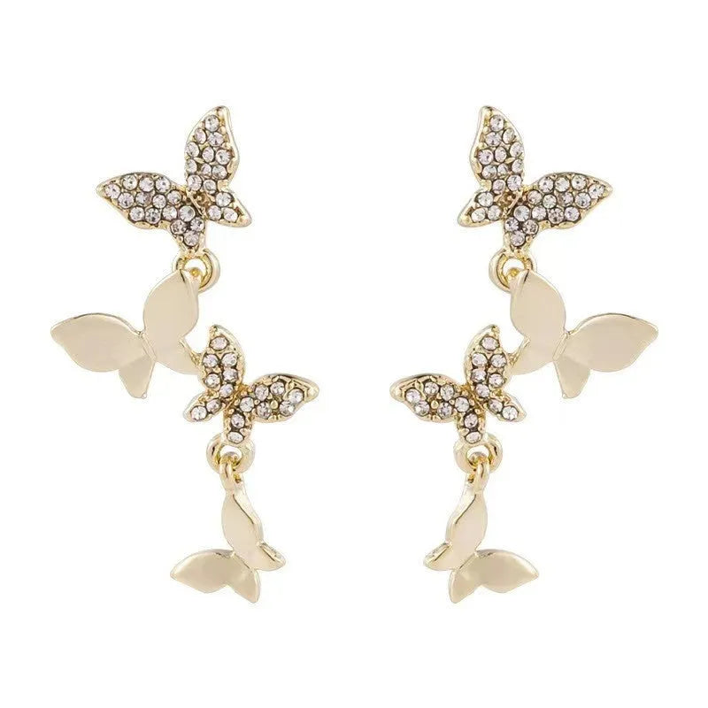 Gold-toned copper butterfly drop earrings with four-butterfly design for women
