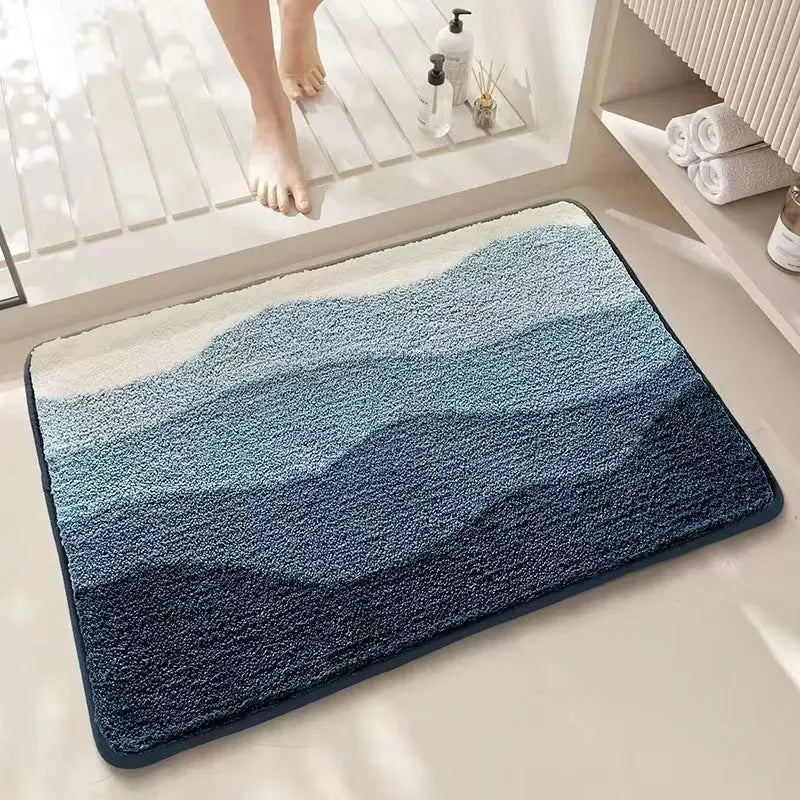 Sky sea coloured square rug with rainbow pattern, showing flat imitation cashmere texture and plastic bottom.