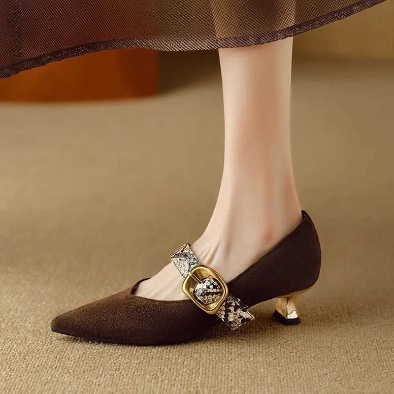 Black French pointed stiletto high heels for women with a buckle strap closure.