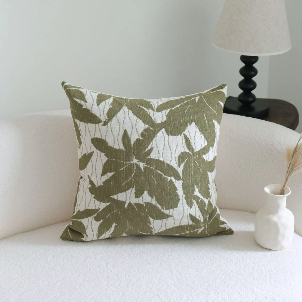 Green botanical pattern hotel sample pillow with tassel detail on linen cotton cover