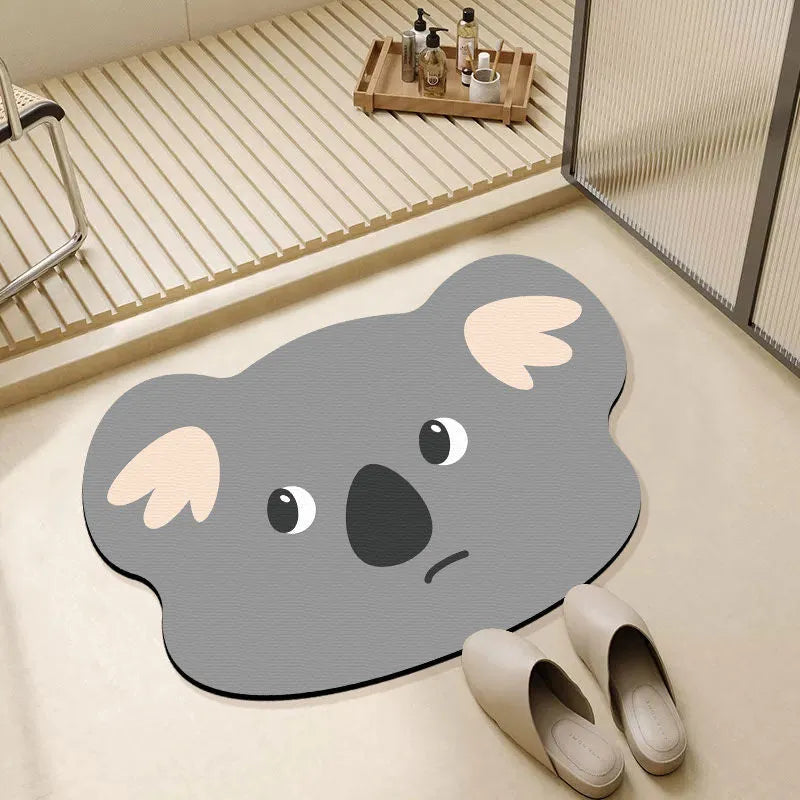 Diatomite bathroom absorbent mat in a cartoon animal design on a bathroom floor.