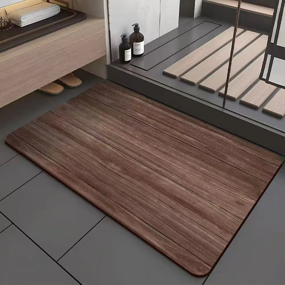 Square diatomite bathroom floor mat with wood grain geometric pattern in a bathroom setting.