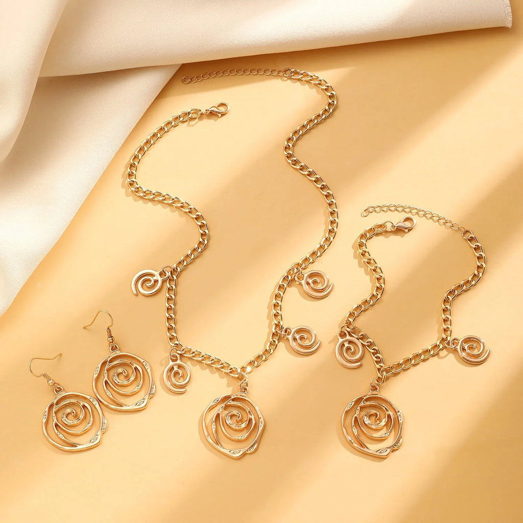 Spiral donut design alloy necklace, bracelet and earrings set in gold or silver electroplated finish.