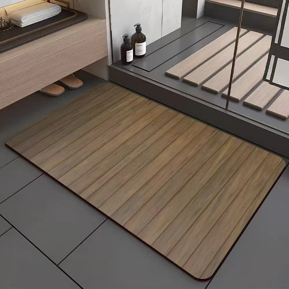 Square diatomite bathroom floor mat with wood grain geometric pattern in a bathroom setting.