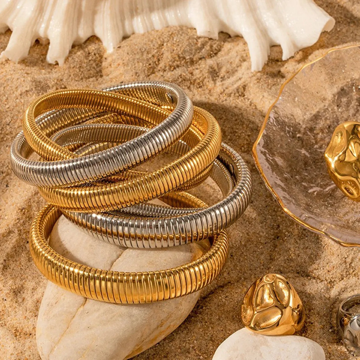 Women's elastic titanium steel bracelet with vertical stripe ring pattern in gold finish