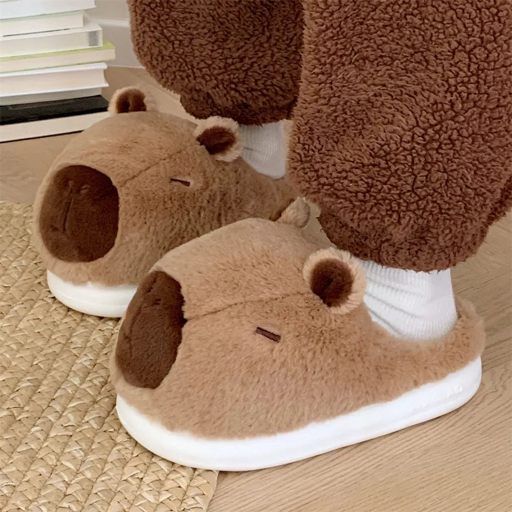 Cartoon Capabala cotton slippers with brown suede upper and round toe, shown on a light indoor floor