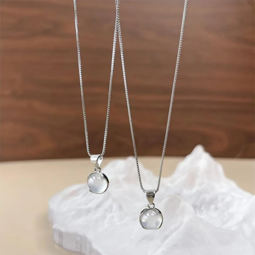 Korean-style oval pendant necklace with geometric eight-point star charm on an adjustable box chain.
